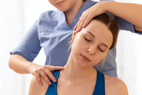 Neck Physiotherapy Assessment and Manual Therapy A physiotherapist performs gentle manual therapy during a neck assessment to evaluate mobility and relieve pain. The image highlights physiotherapy treatment for neck pain, stiffness, headaches, and improved range of motion.